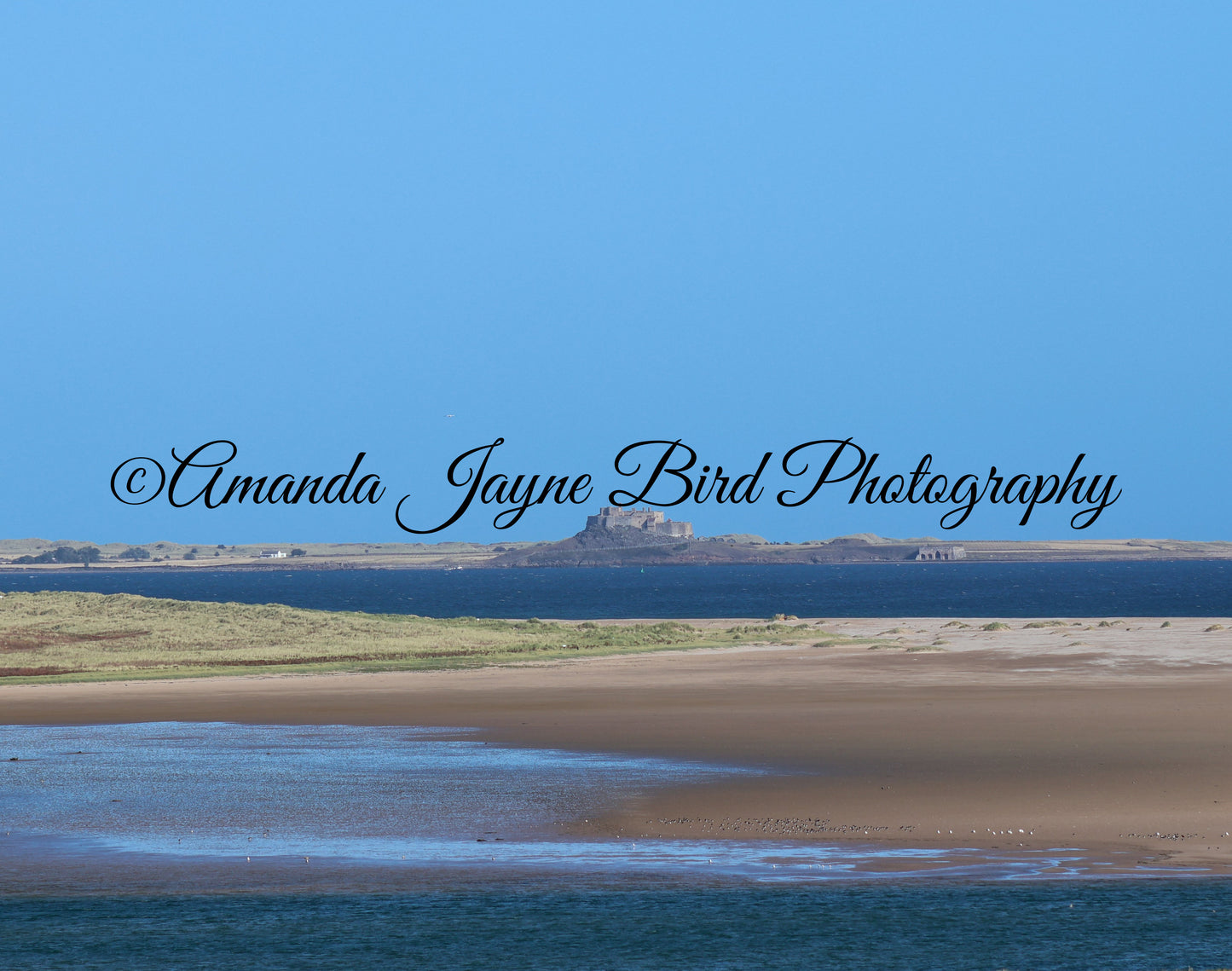 Bundle Bay Beach and Lindisfarne Castle